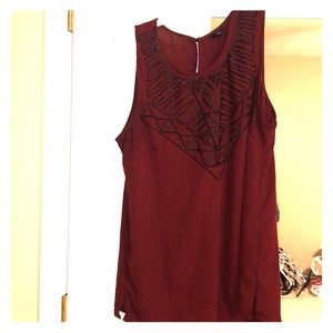 Beautiful sleeveless blouse with bead detailing